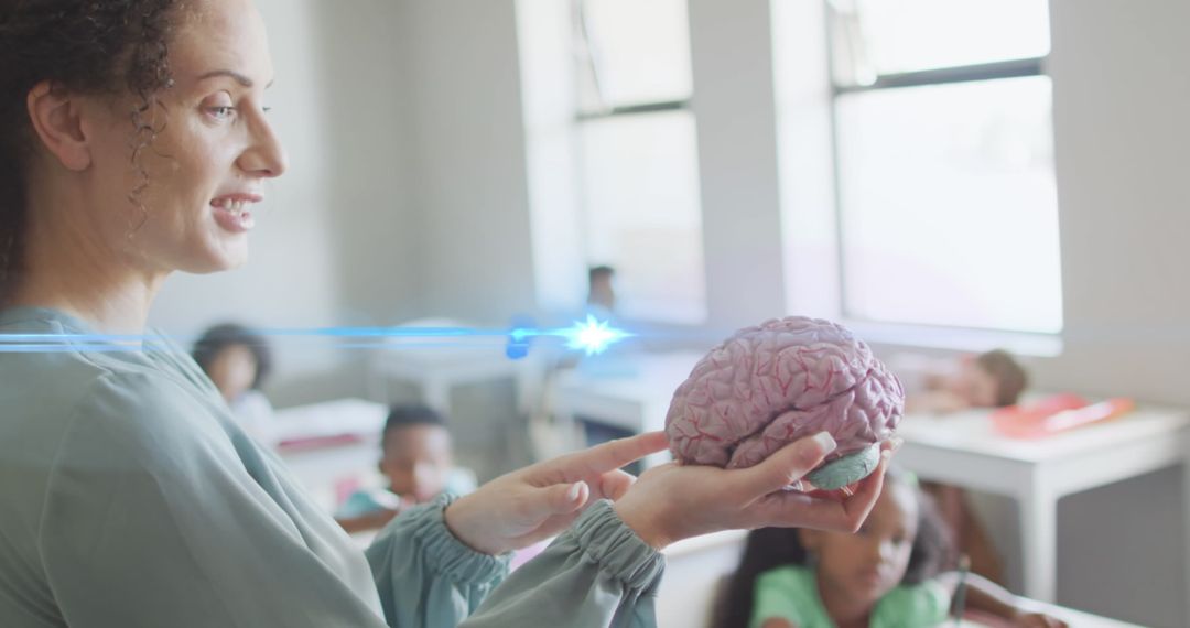 Teacher Presenting Brain Model to Engaged Students in Classroom