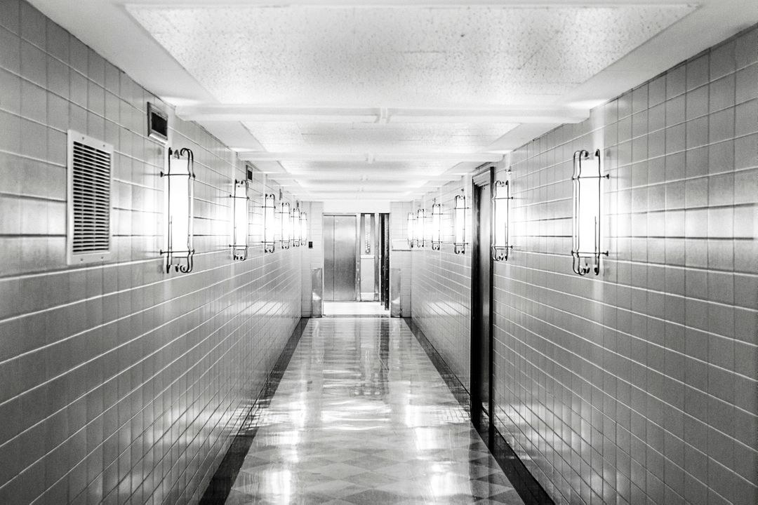 Long Empty Corridor with Fluorescent Lighting in Black and White - Free Images, Stock Photos and Pictures on Pikwizard.com