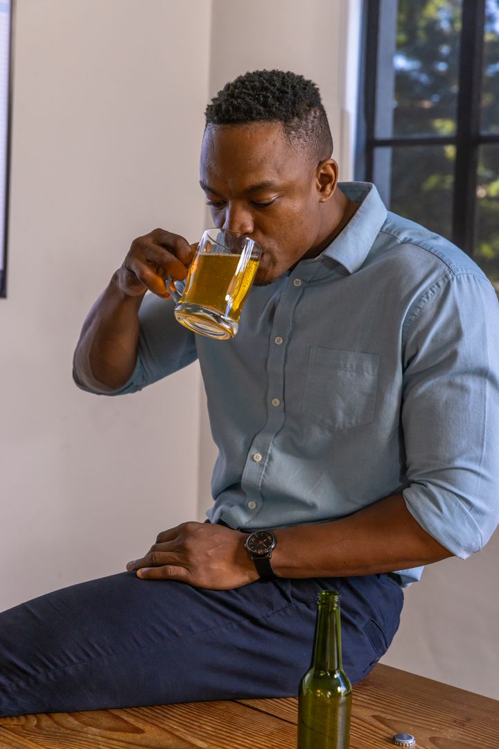 Man Enjoying Solo Relaxation and Beer at Home