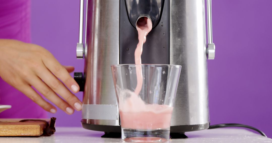 Person Using Juice Extractor to Make Fresh Smoothie - Free Images, Stock Photos and Pictures on Pikwizard.com