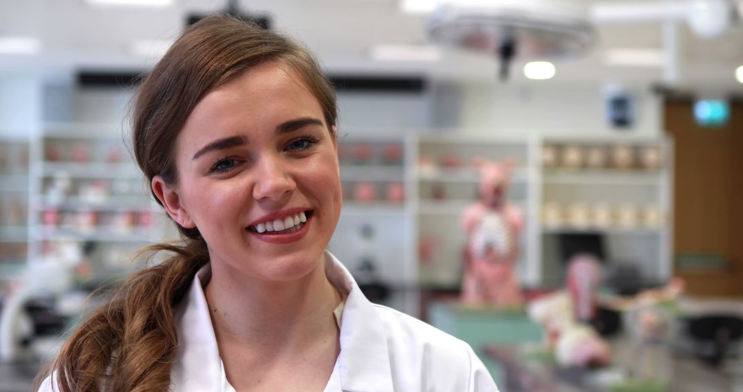 Female Medical Student Smiling in Modern Laboratory - Free Images, Stock Photos and Pictures on Pikwizard.com