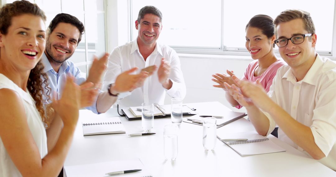 Happy Business Team Clapping After Successful Presentation in Office - Free Images, Stock Photos and Pictures on Pikwizard.com