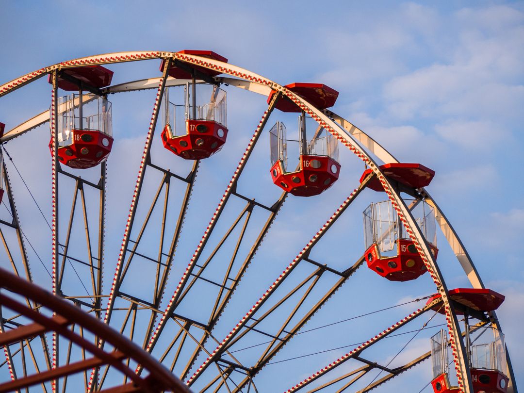 Close-Up of Ferris Wheel Against Blue Sky - Free Images, Stock Photos and Pictures on Pikwizard.com