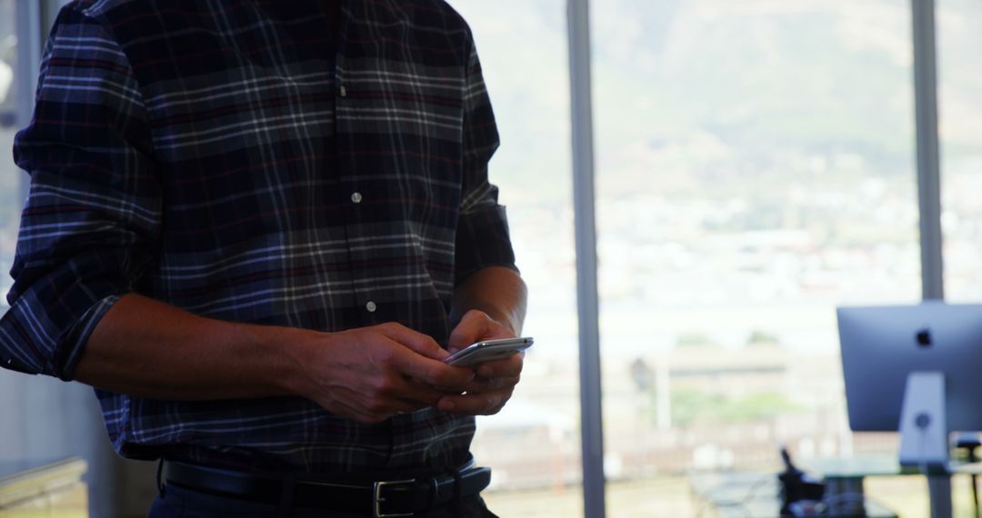 Close-up of Person Texting on Smartphone in Modern Office - Free Images, Stock Photos and Pictures on Pikwizard.com