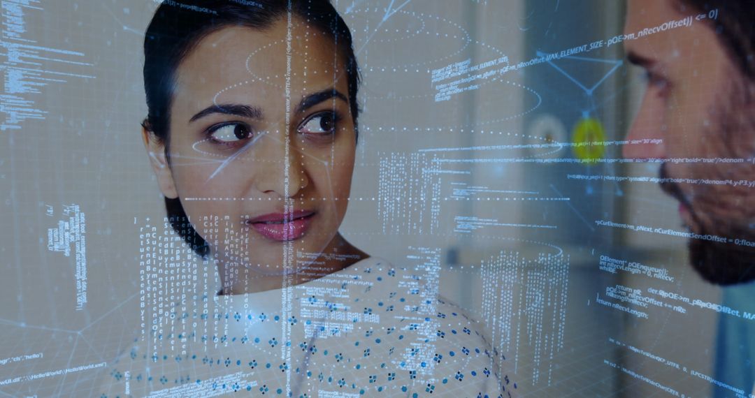 Colleagues Examining Holographic Interface with Programming Code