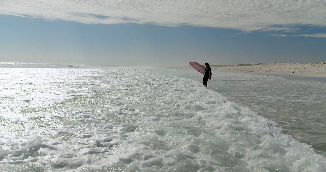 Surfer Standing at Ocean's Edge Anticipating Waves - Free Images, Stock Photos and Pictures on Pikwizard.com