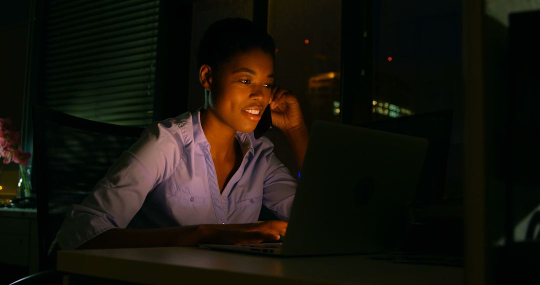 African American Woman Working Late Night on Laptop in Office - Free Images, Stock Photos and Pictures on Pikwizard.com