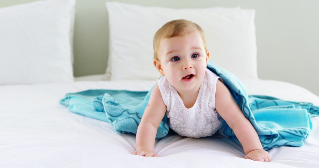 Adorable Baby Crawling on Bed with Blue Blanket - Free Images, Stock Photos and Pictures on Pikwizard.com