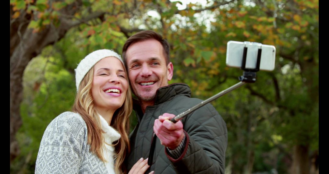 Happy Couple Taking Selfie Outdoors on Autumn Day - Free Images, Stock Photos and Pictures on Pikwizard.com