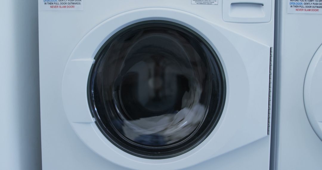 Front Load Washing Machine in Motion Close-Up - Free Images, Stock Photos and Pictures on Pikwizard.com