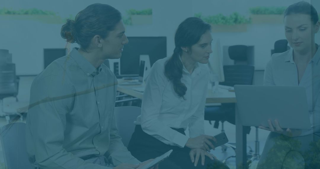 Diverse Business People Collaborating on Financial Data Analysis in Office