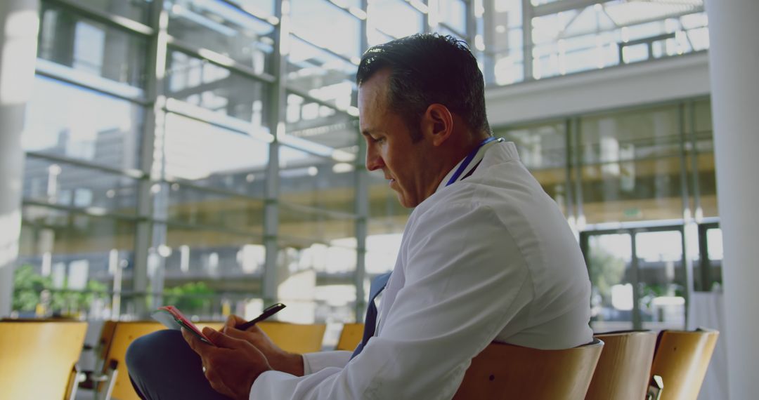 Doctor Writing Documentation in Modern Hospital Environment - Free Images, Stock Photos and Pictures on Pikwizard.com