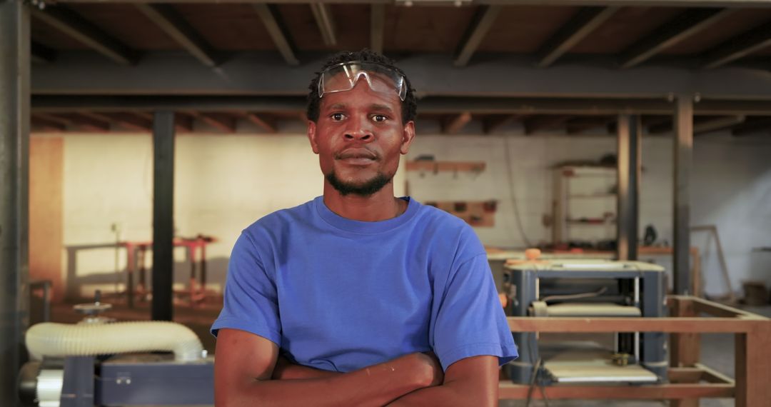 Confident Craftsman in Workshop with Protective Gear
