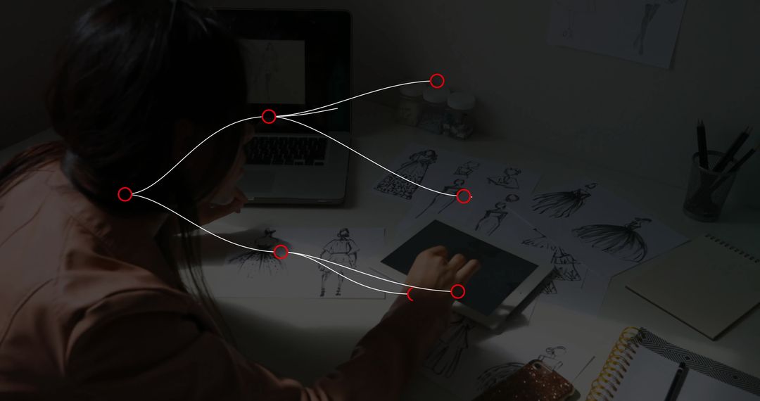 Fashion Designer Engaged with Digital Sketching in Studio