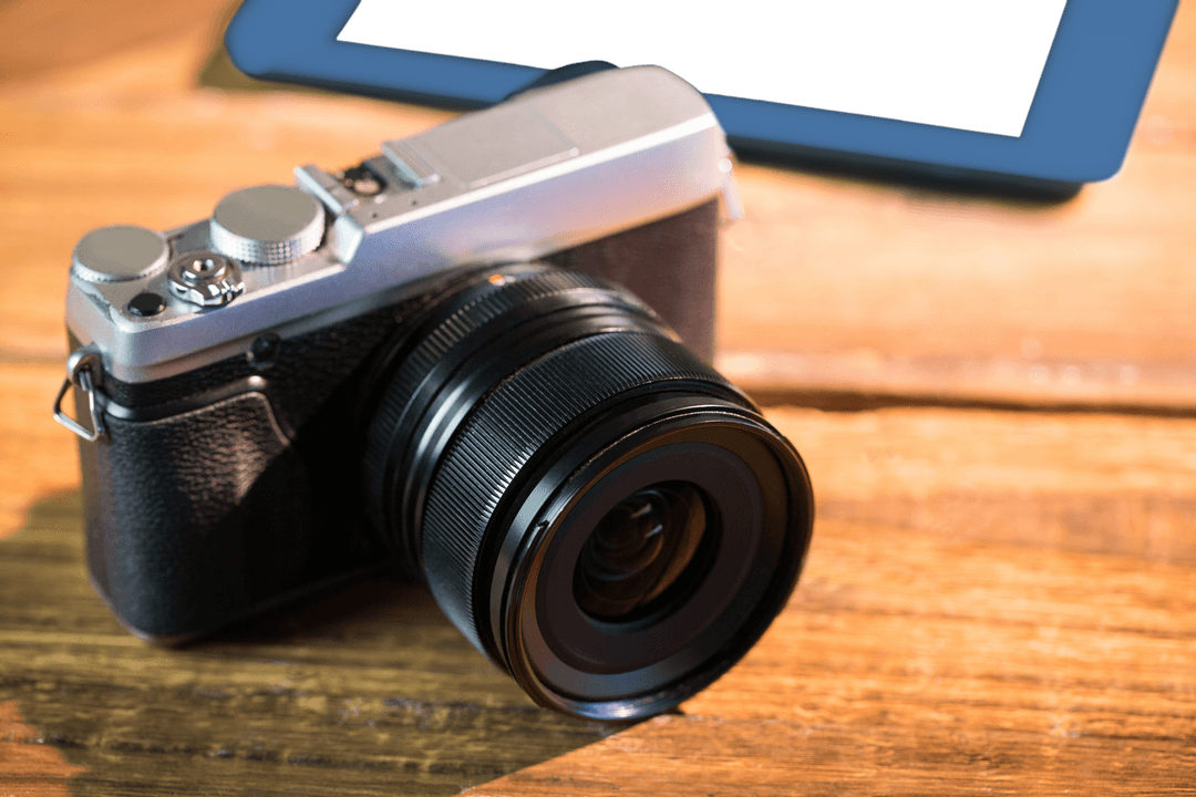 Transparent Classic Camera and Tablet on Wooden Surface