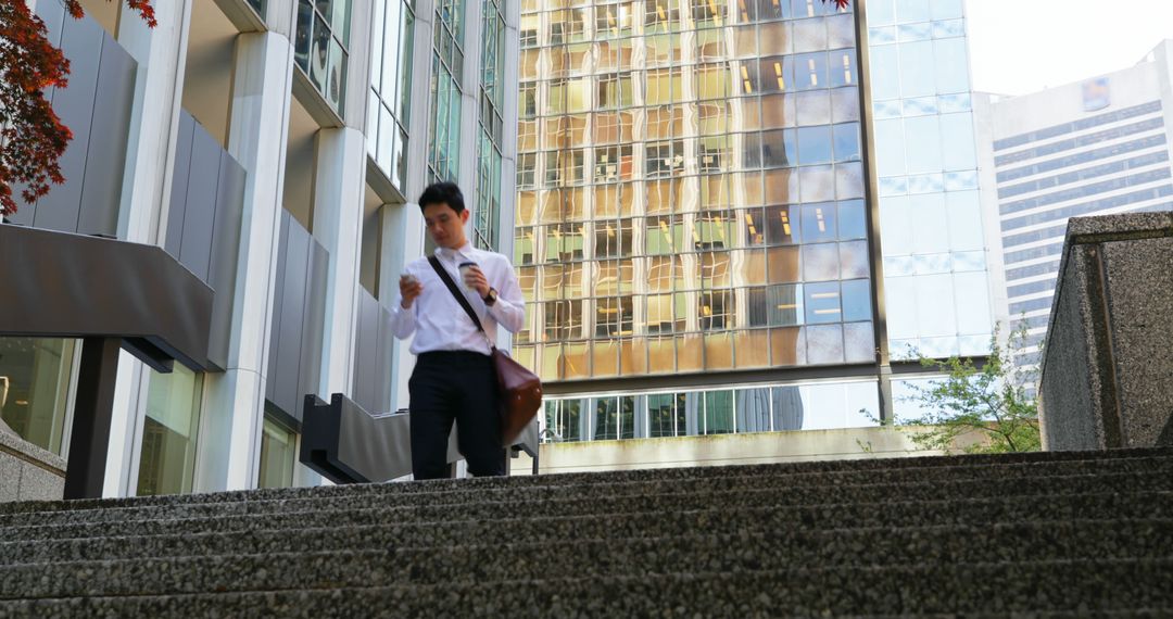 Businessman Descending Stairs in Modern Urban Environment - Free Images, Stock Photos and Pictures on Pikwizard.com