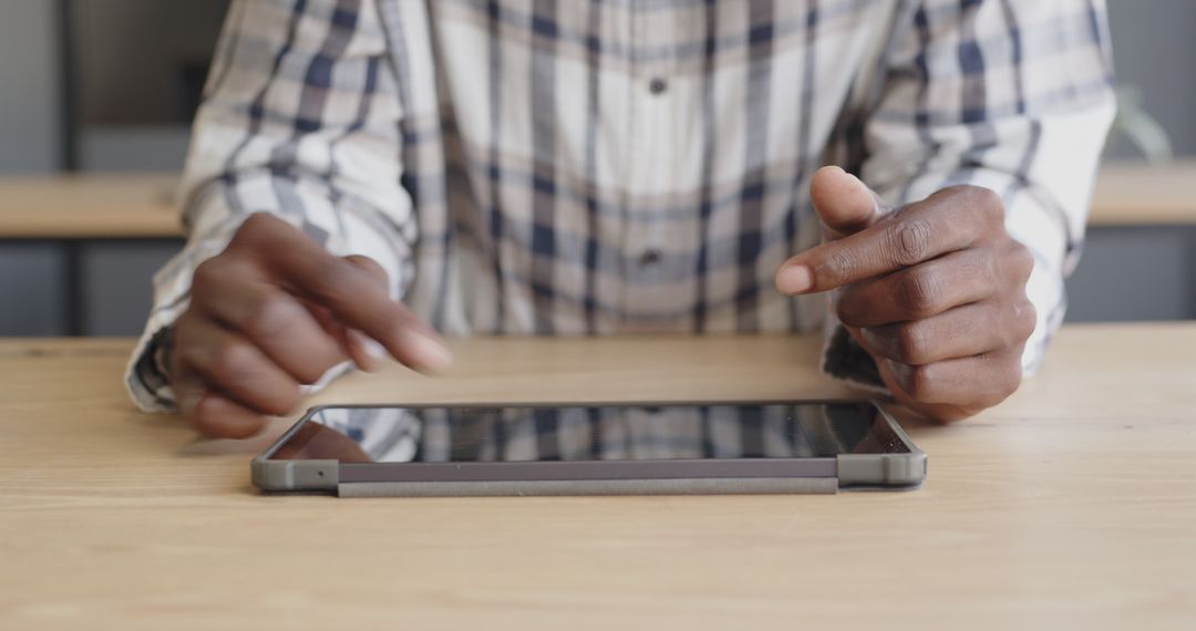 Hands Navigating Tablet for Productive Digital Workflow