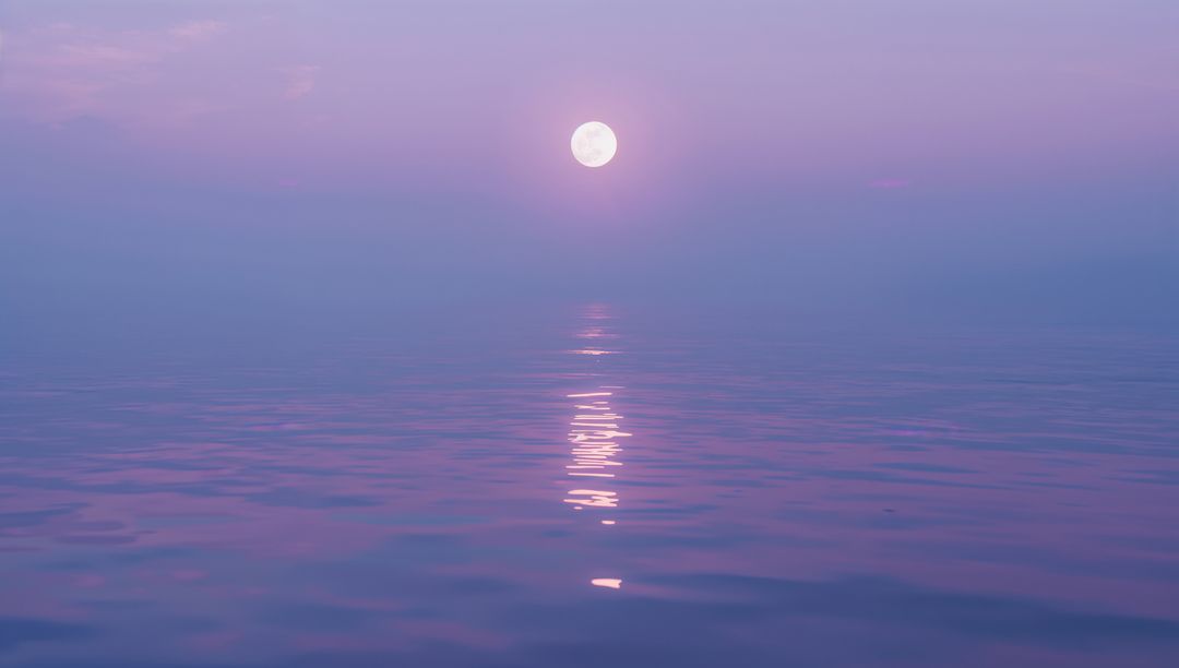 Full Moon Reflecting Across Serene Ocean at Twilight