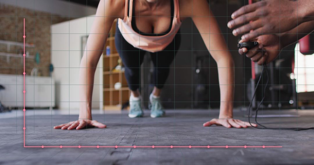 Close-up of Woman Doing Push-Ups with Trainer Timing - Free Images, Stock Photos and Pictures on Pikwizard.com