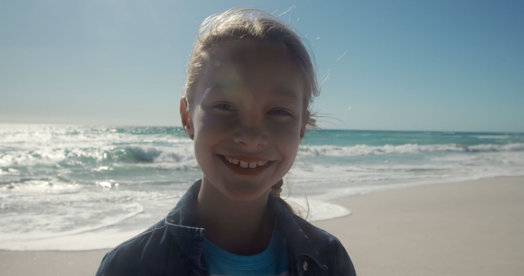 Smiling Child Enjoying Sunny Beach Day - Free Images, Stock Photos and Pictures on Pikwizard.com