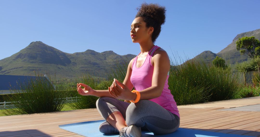 Serene Woman Meditating Outdoors in Nature - Free Images, Stock Photos and Pictures on Pikwizard.com