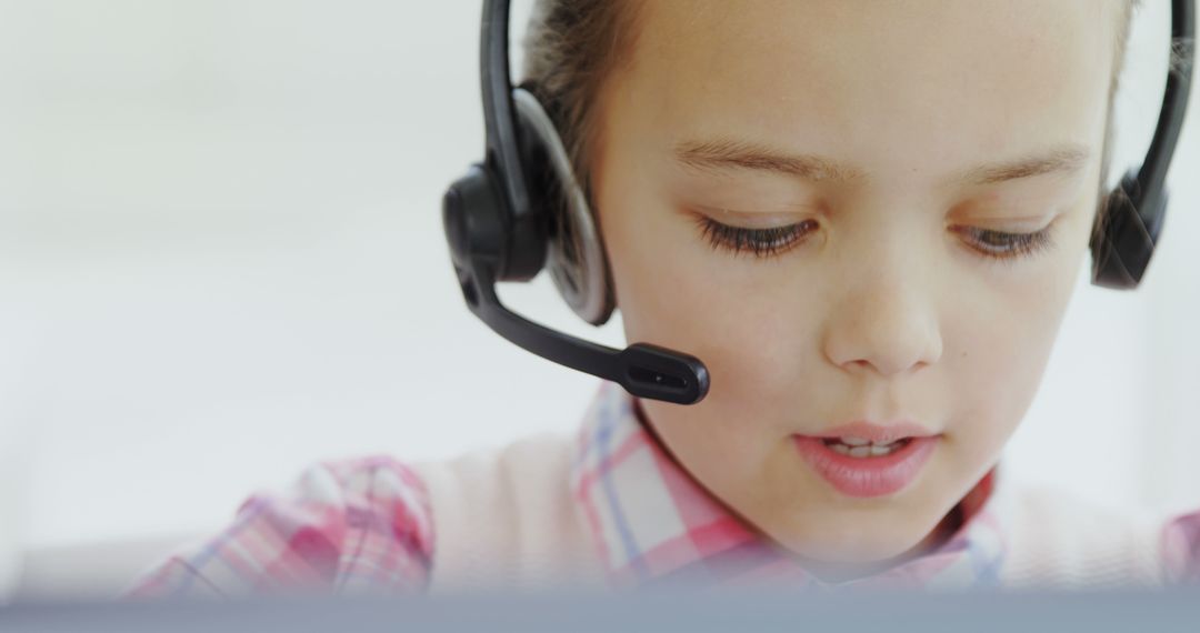 Young Boy Using Headset in Office Setting