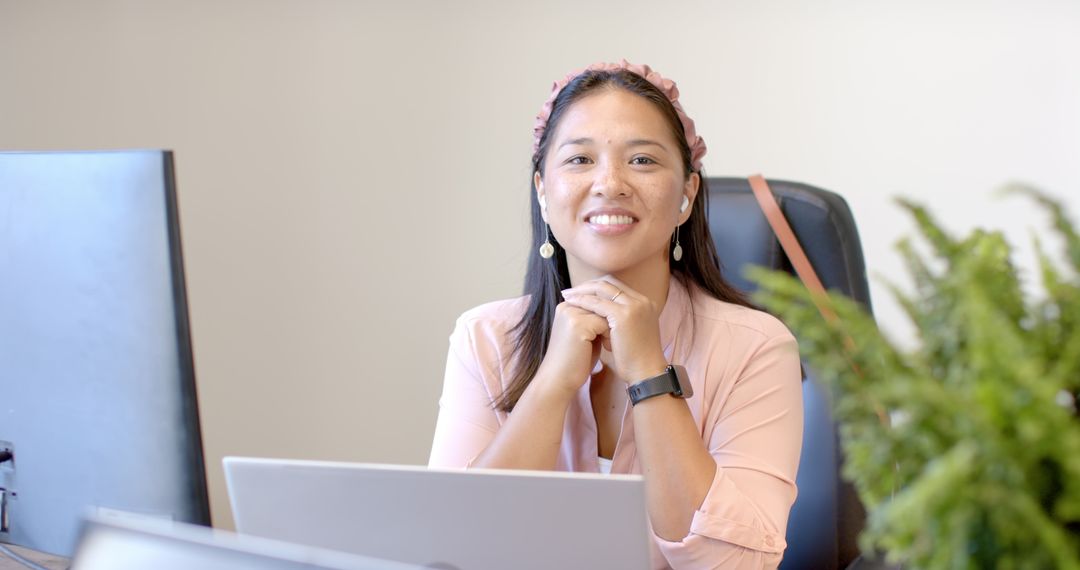 Woman in Office Focusing on Digital Work with Laptop