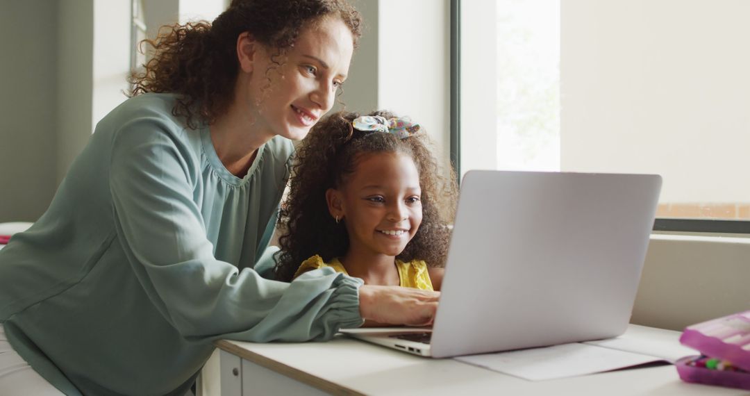 Mother Teaching Young Daughter How to Use Laptop at Home - Free Images, Stock Photos and Pictures on Pikwizard.com