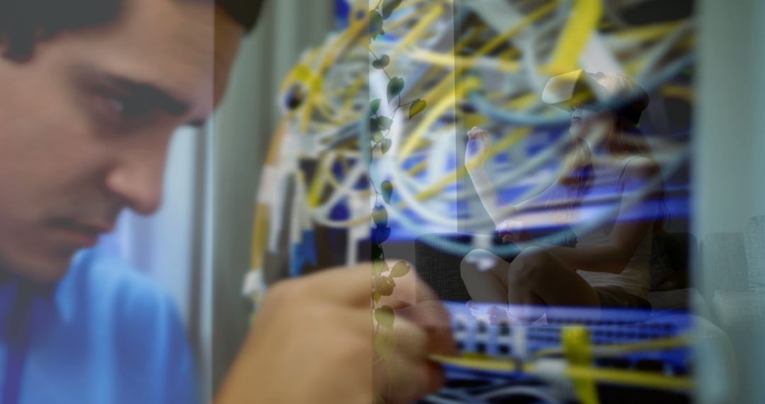 A young Caucasian man is focused on organizing cables in a server room, with copy space - Free Images, Stock Photos and Pictures on Pikwizard.com