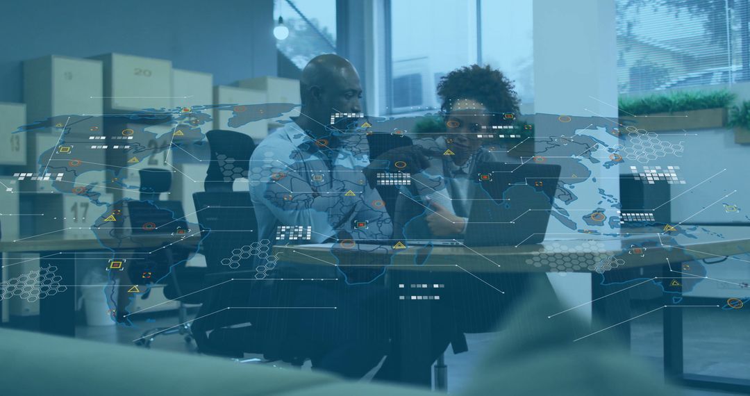 Corporate Team Analyzing Digital Data Overlaid Map in Modern Office