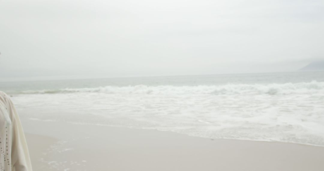 Empty Beach with Soft Waves on Cloudy Day - Free Images, Stock Photos and Pictures on Pikwizard.com