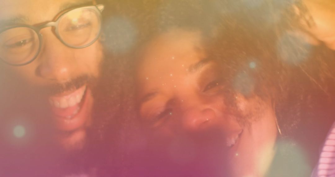 Smiling Couple Enjoying Warm Party Atmosphere