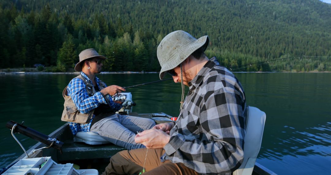 Two Men Fishing on Mountain Lake - Free Images, Stock Photos and Pictures on Pikwizard.com