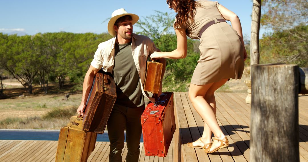 A couple in travel attire with vintage suitcases begins an adventure on a wooden dock. - Free Images, Stock Photos and Pictures on Pikwizard.com