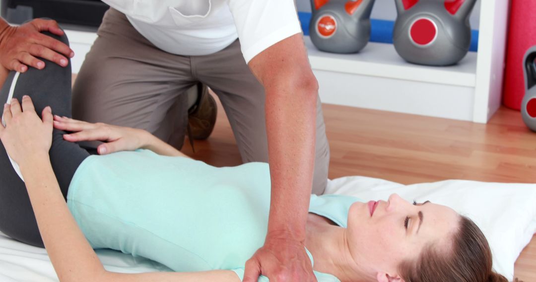 Physical Therapist Assisting Woman with Rehabilitation Exercise - Free Images, Stock Photos and Pictures on Pikwizard.com