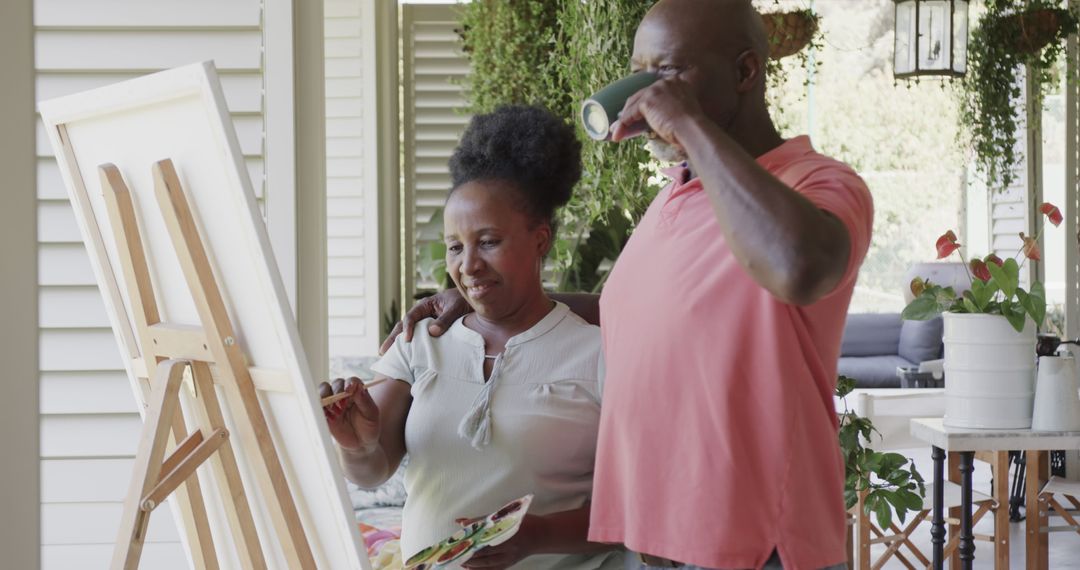 Senior Couple Enjoying Painting Together on Back Porch - Free Images, Stock Photos and Pictures on Pikwizard.com