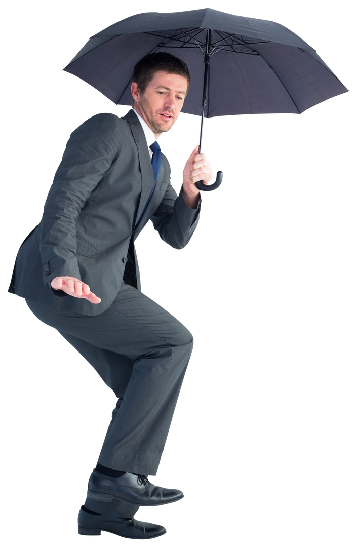 Businessman Holding Black Umbrella in Shelter Position - Download Free Stock Images Pikwizard.com