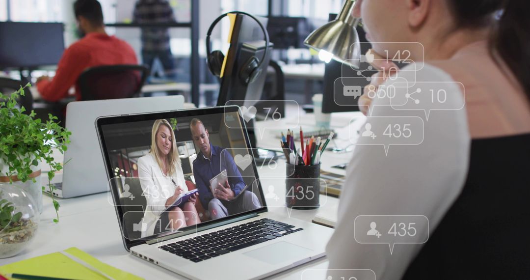 Woman viewing remote presenters on laptop with social engagement icons and metrics overlay