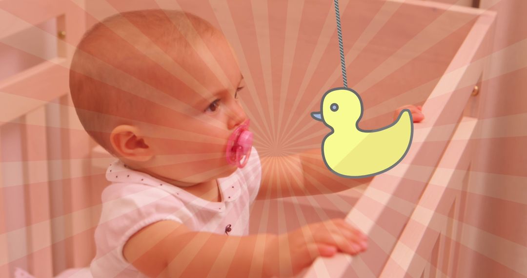Happy Caucasian Baby with Cartoon Duck in Crib