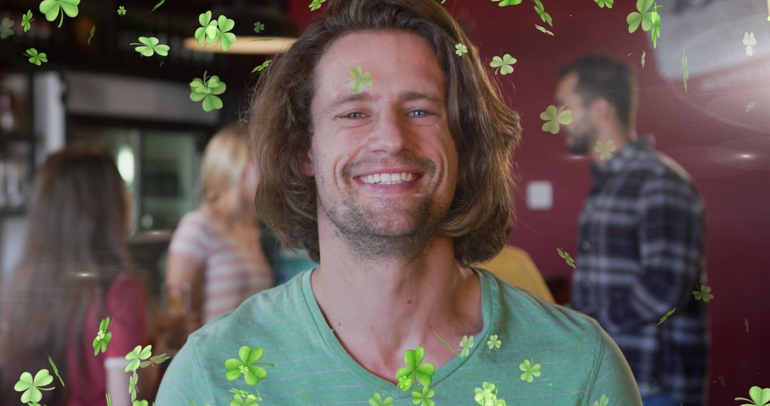 Man Celebrating in Shamrock Decorated Bar with Friends