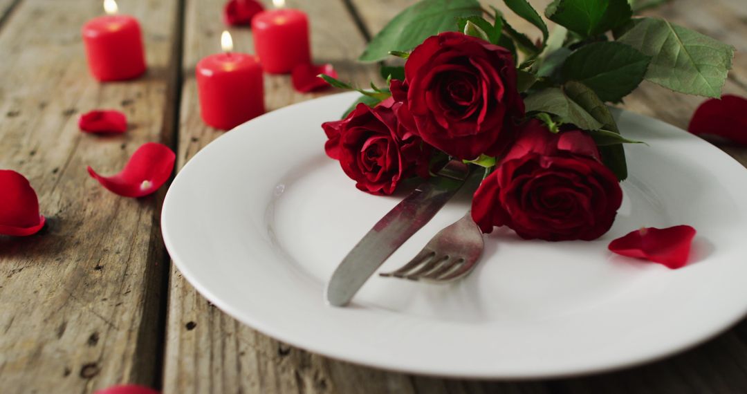 Romantic Table Setting with Red Roses and Candles