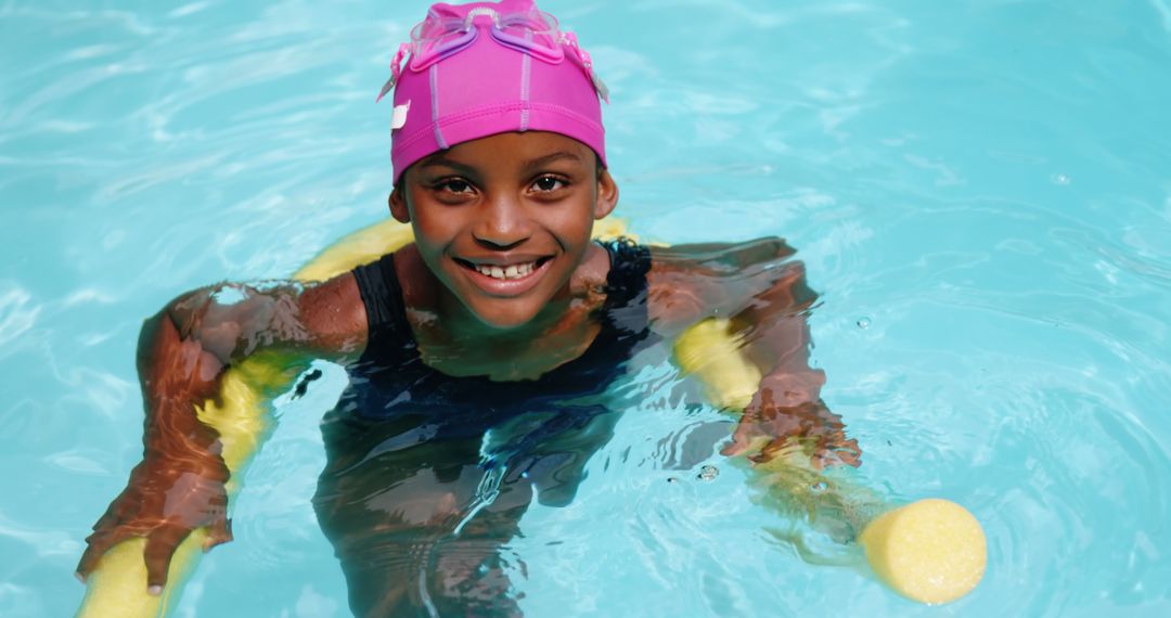 Happy Young Girl Swimming with Pink Swim Cap and Smile - Free Images, Stock Photos and Pictures on Pikwizard.com