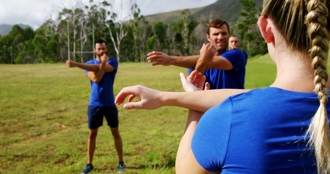 Group of Athletes Stretching in Park Before Exercise - Free Images, Stock Photos and Pictures on Pikwizard.com