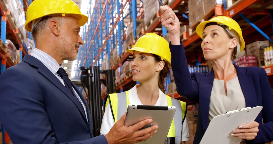 Warehouse Team Discussing Logistics While Using Digital Tools