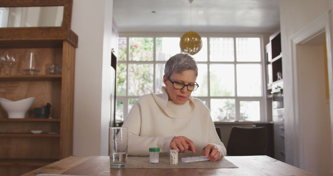 Senior Woman Taking Medication at Home - Free Images, Stock Photos and Pictures on Pikwizard.com