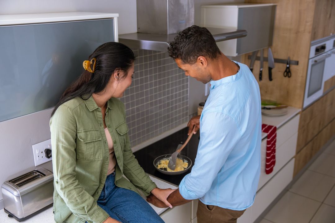 Couple Embracing Cooking Time Together in Modern Kitchen