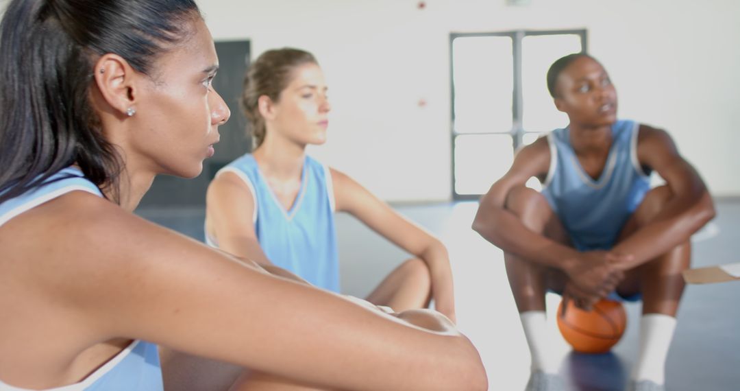 Female Basketball Team Building Teamwork During Relaxing Moment