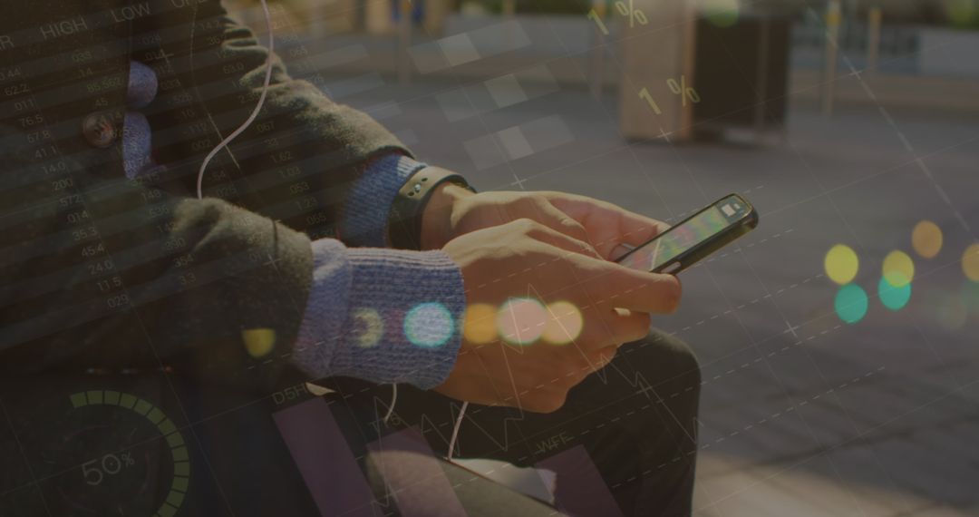 Person Engaged with Smartphone in Urban Environment