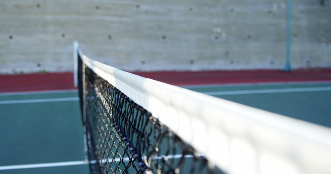 Close-up view of tennis net on empty court - Free Images, Stock Photos and Pictures on Pikwizard.com