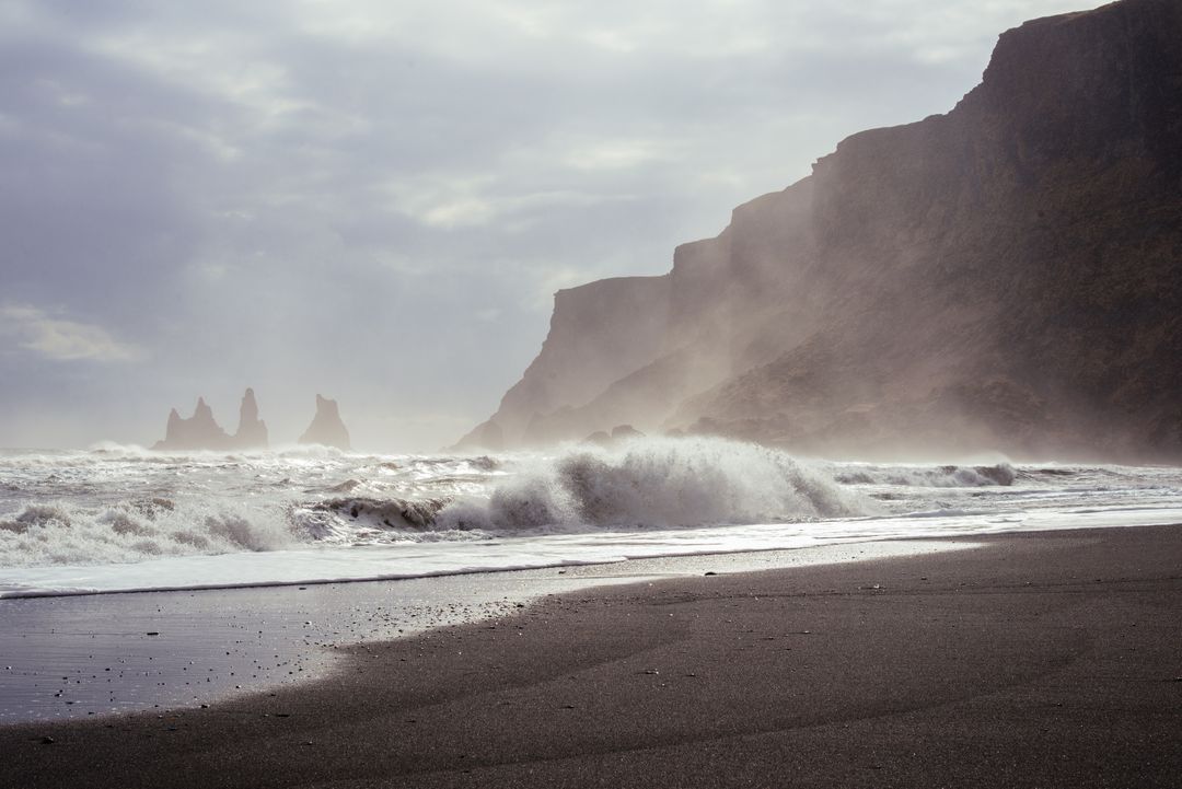 Stormy Waves Crashing on Rocky Beach with Distant Sea Stacks - Free Images, Stock Photos and Pictures on Pikwizard.com